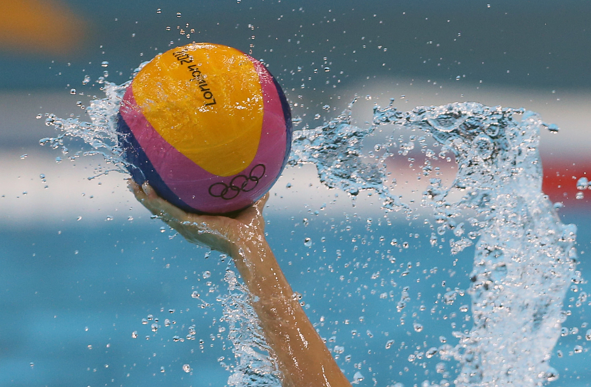 general view of water splashing off a water polo ball as it is c