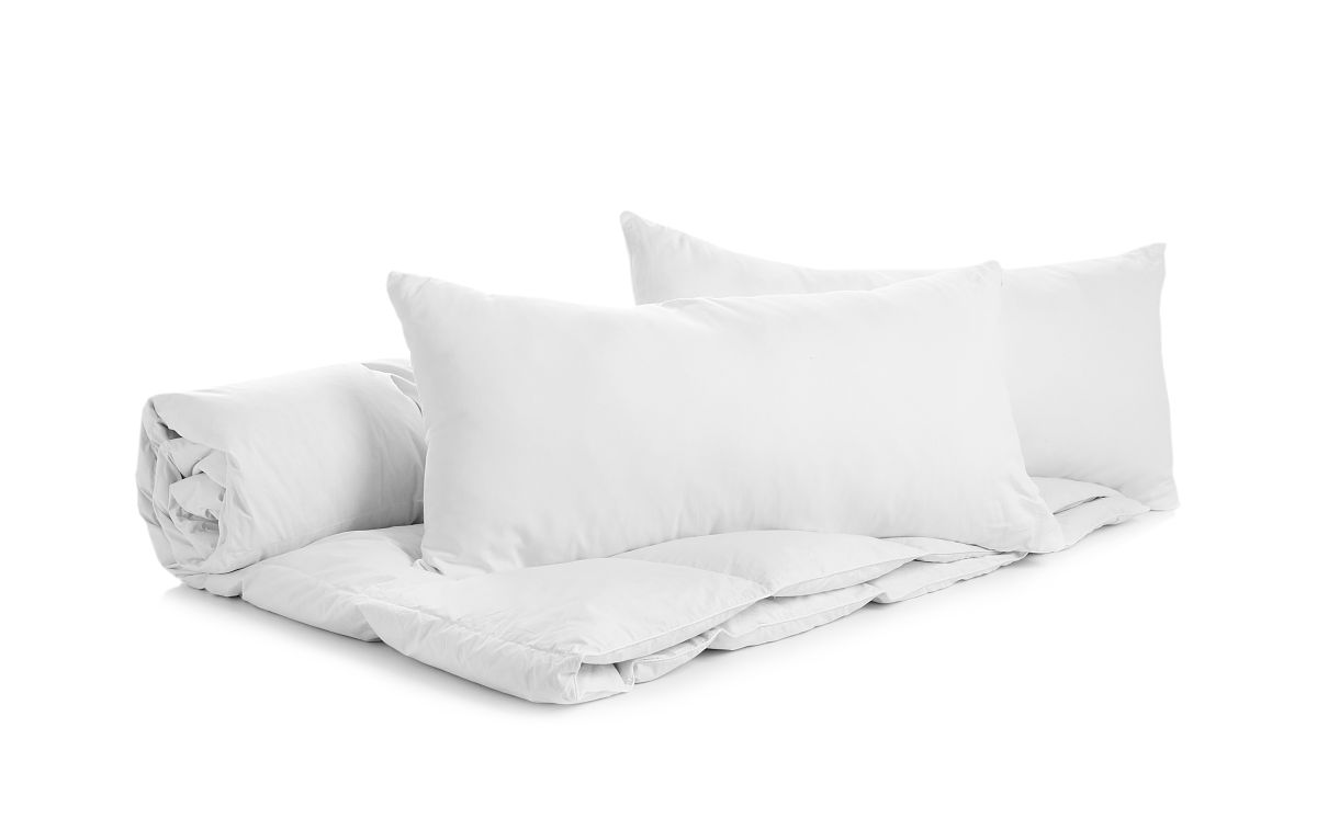 soft blanket and pillows on white background