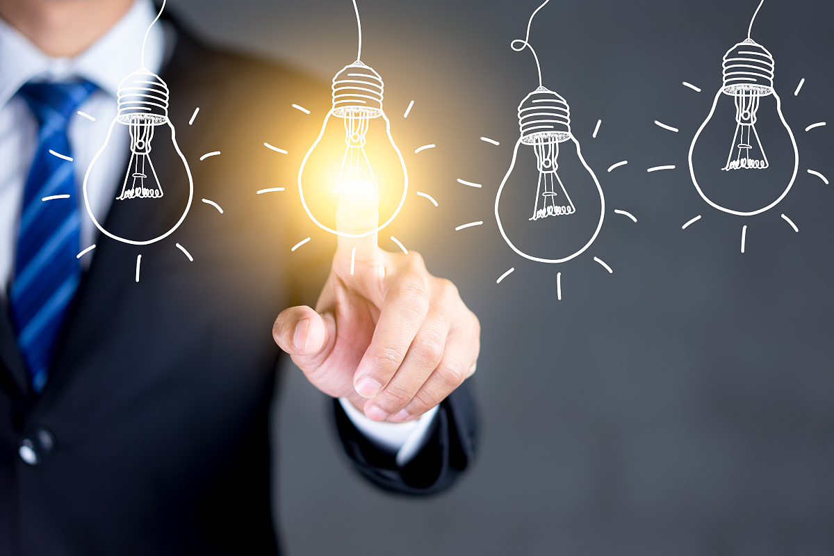 businessman hand touching light bulbs, new ideas with innovative