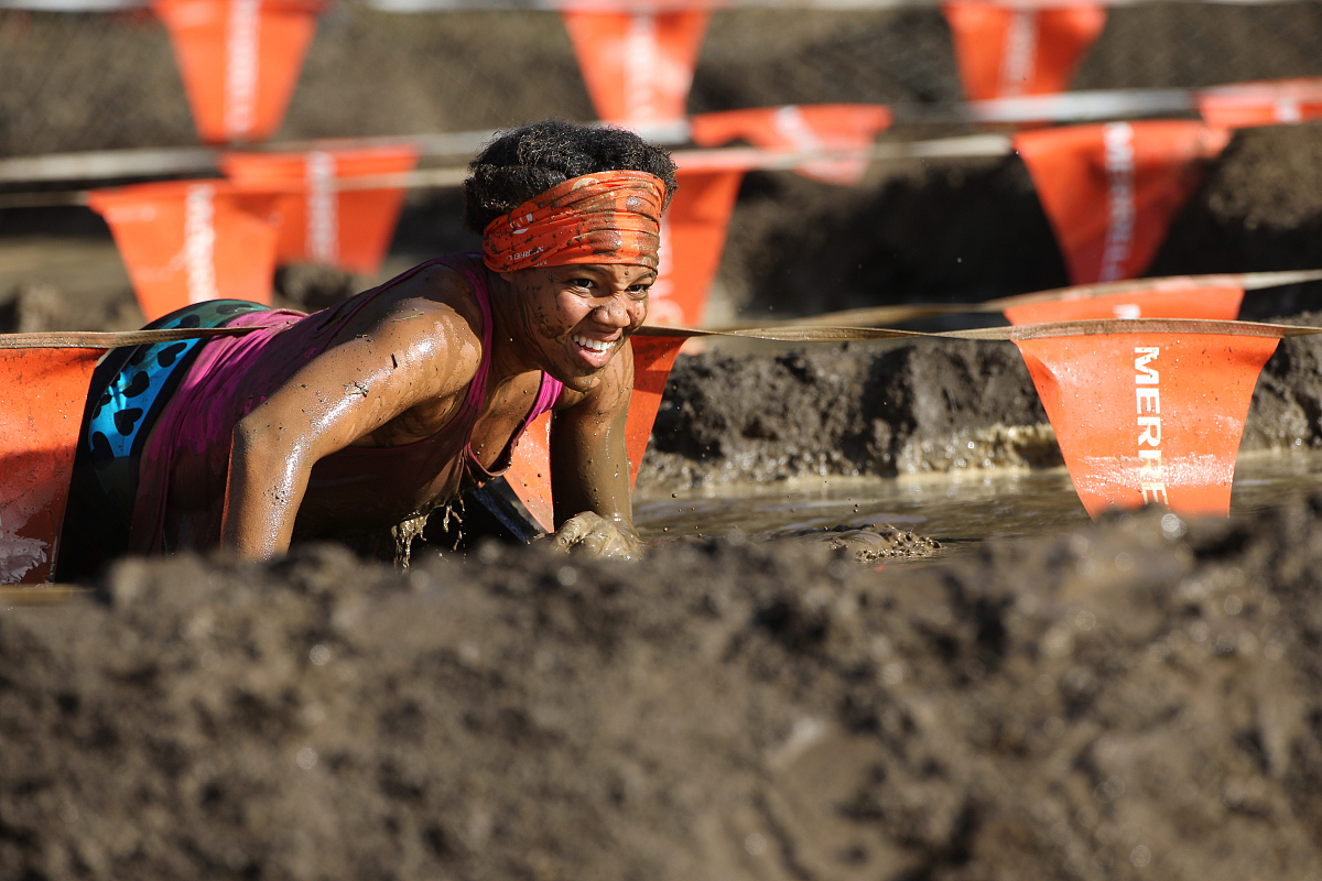 ***_***expressions of competitors as they tackle the mud pit dur