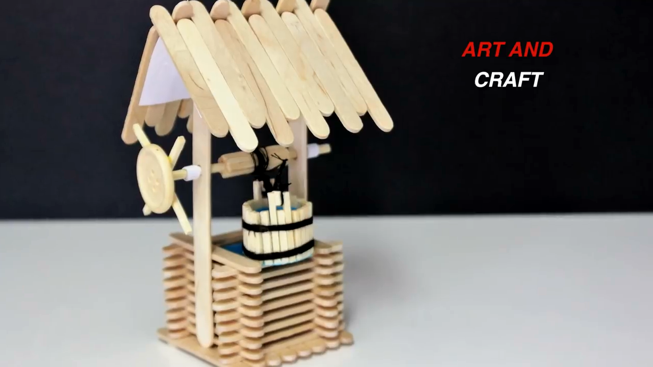 幼儿大班手工课制作,冰激凌木棒制作一个能拉动水桶的抽水水塔