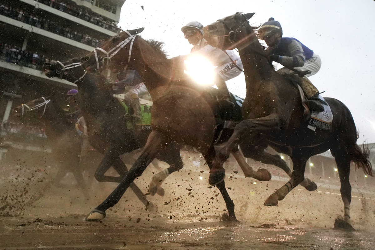 louisville, ky - may 05:  the field heads toward the first turn 