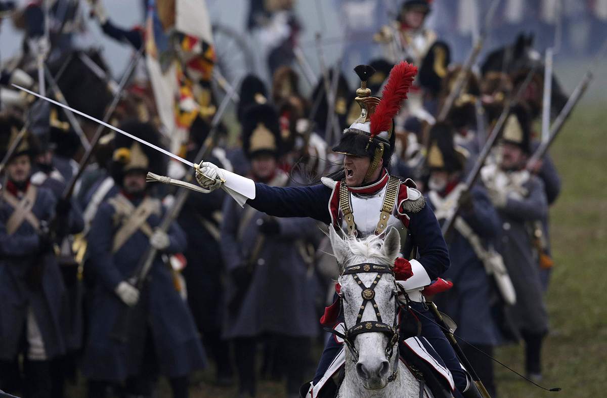 history enthusiasts dressed as soldiers fight during the re-enac