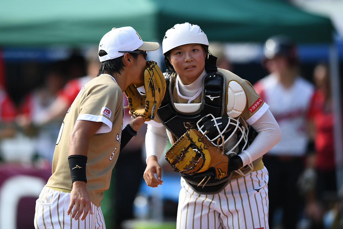 chiba, japan - august 12: yu yamamoto #5 (l) of japan speaks wit