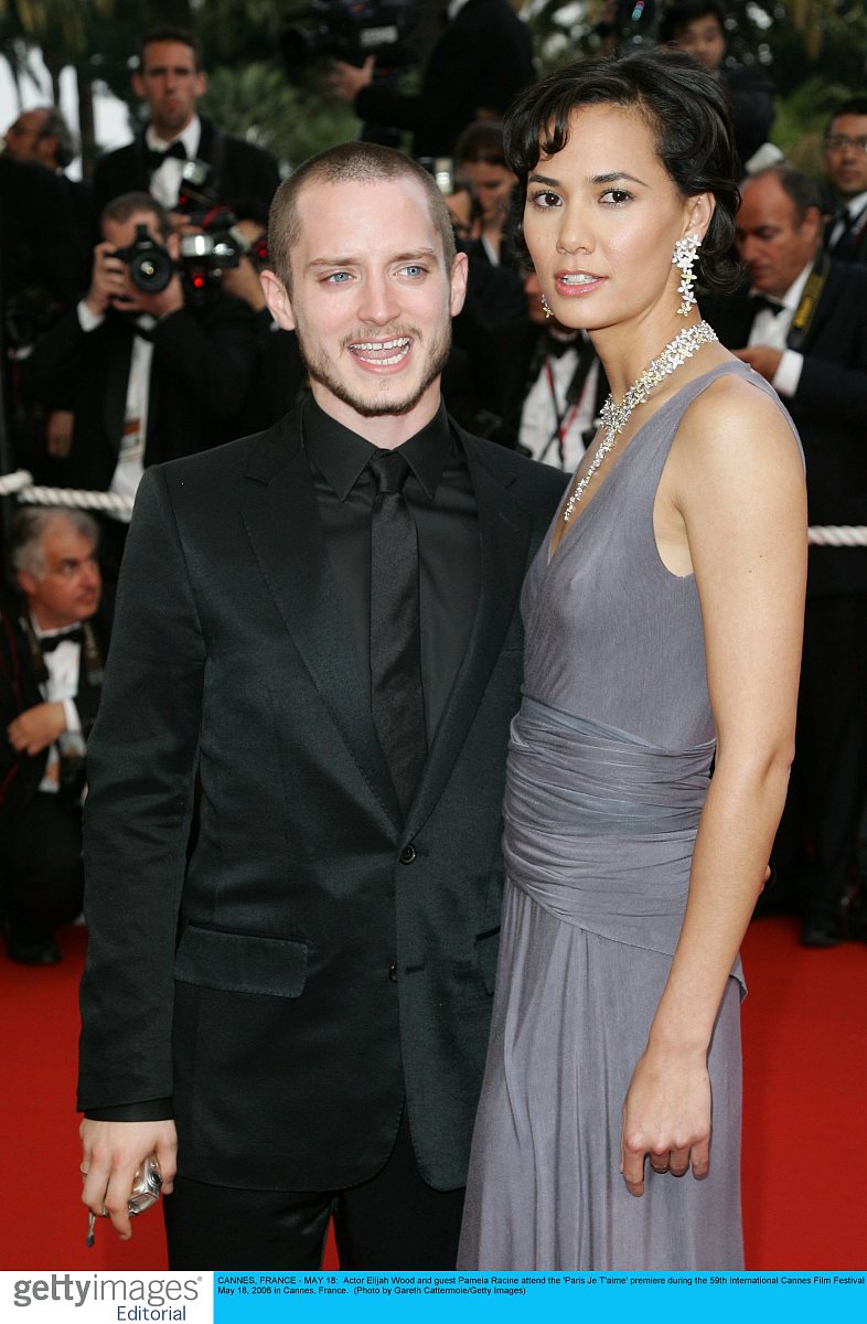 cannes, france - may 18:  actor elijah wood and guest pamela rac