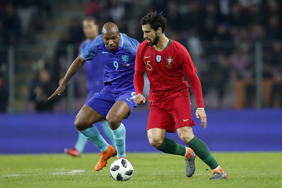 (l-r) ryan babel of holland, andre gomes of portugal during the 