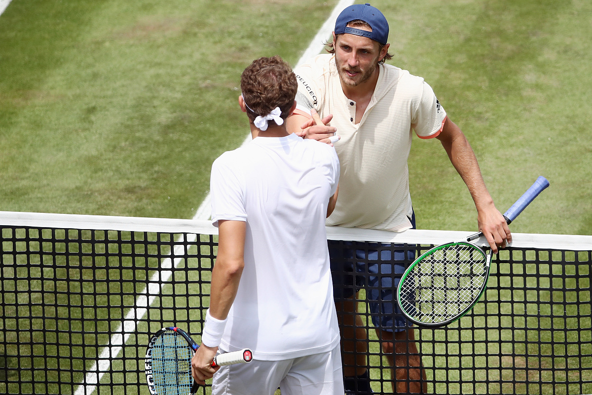 stuttgart, germany - june 15:  lucas pouille of france shakes ha