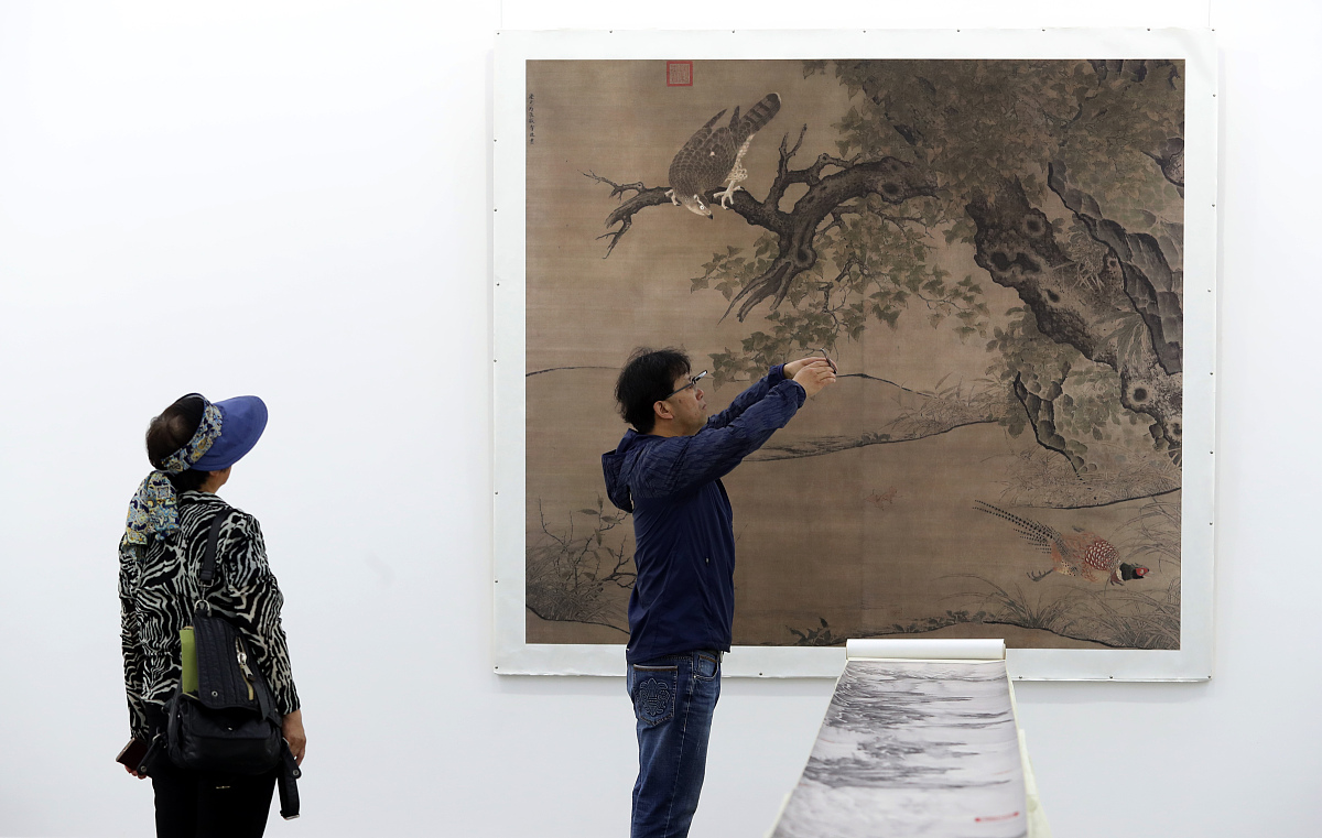 把下面这段话翻译成英文：51324阴、阳互动观道的二元互为结构关系中国绘画的形态语言的发展与变化也遵循着道的宇宙运行规律。万事万物是在阴阳的对立与联系中互为一个整体。绘画作品的创造与生成自然也是虚实结合的存在。客观存在为实主观想象为虚；可视所见者为实不可视见不到者为虚；象为实意为虚所以中国有意象造型之说法。意象即是主客观相结合脱离物体的客观真实在人的主观能动思考之下达到的一种内在特征表现这既是虚实