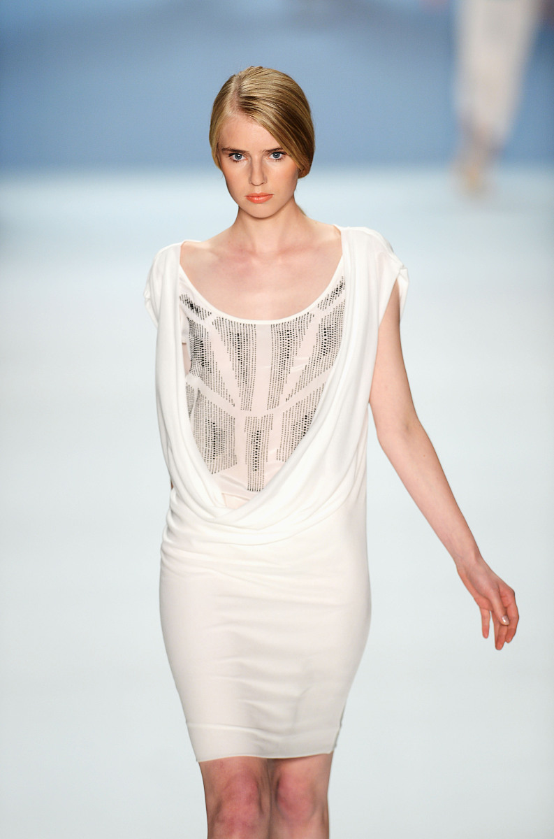 berlin, germany - july 07:  a model runs the catwalk during the 