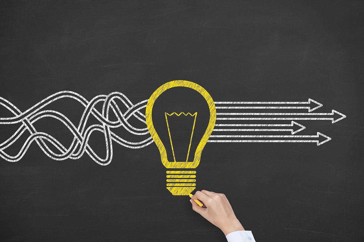 idea solution concept with light bulbs on a chalkboard backgroun
