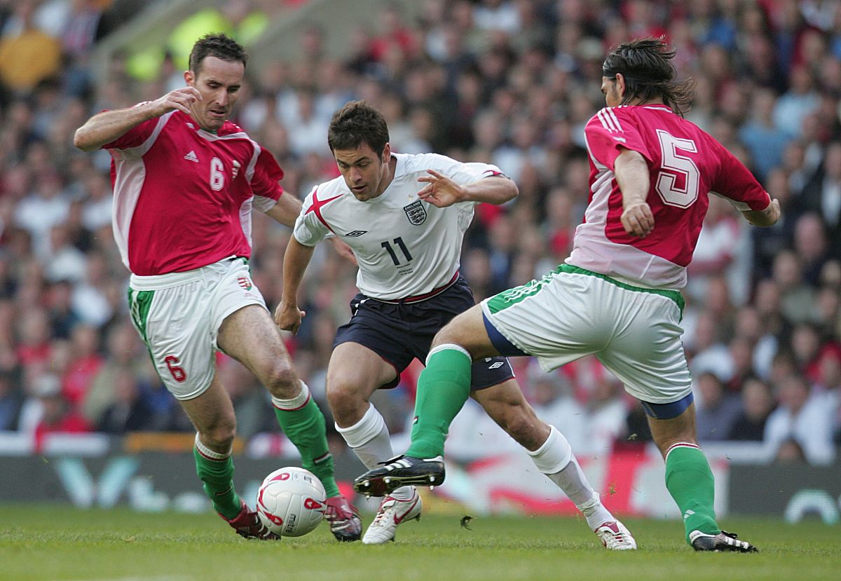 england's joe cole goes past hungary's laszlo eger (r) and balaz