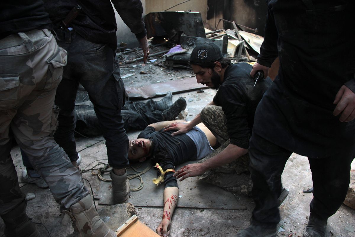 topshots  a wounded opposition fighter lies on the ground after 