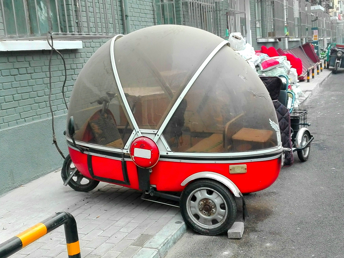 为什么很少见到封闭式的可以遮风挡雨的摩托车？