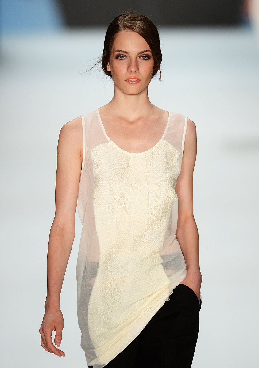 berlin, germany - july 07:  a model runs the catwalk during the 
