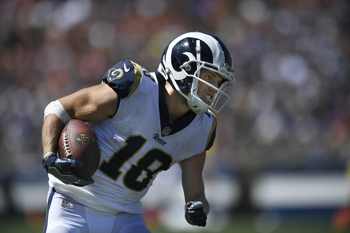 cooper kupp #18 of the los angeles rams runs the ball against th