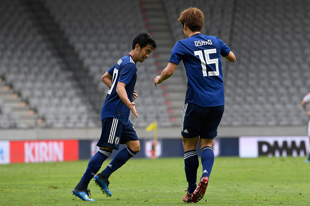 ***_***innsbruck, austria - june 12:  shinji kagawa (l) of japan