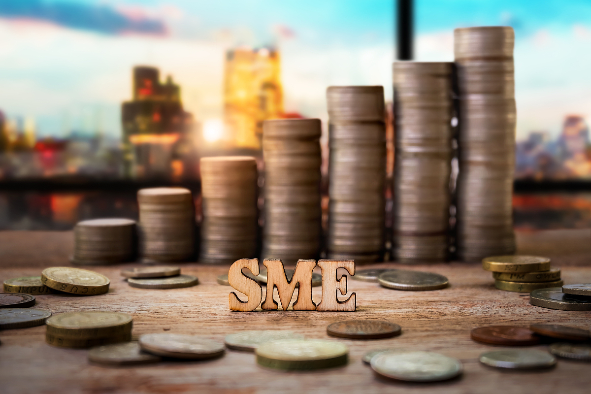 wood with heap and stack of coins for business and finance conce