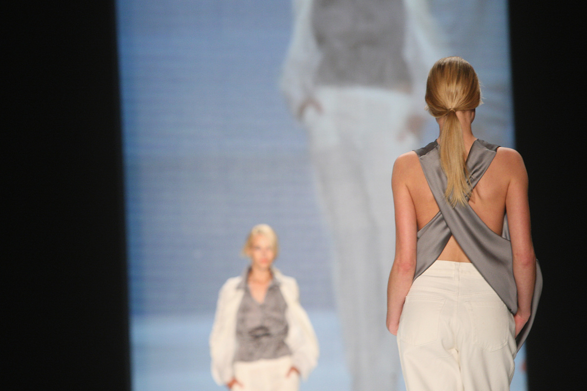 berlin, germany - july 07:  a model runs the catwalk during the 