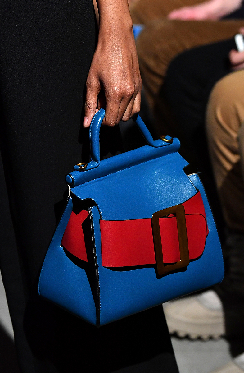 new york, ny - february 11:  a model, handbag detail, walks the 