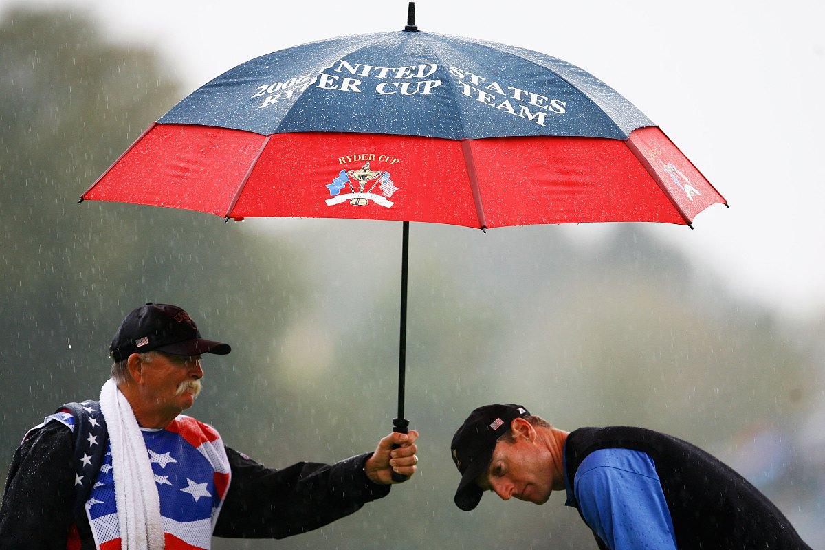 kildare, ireland - september 23: caddy mike cowan holds an umbre