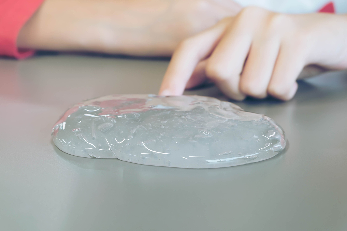 kid playing handmade toy called slime, selective focus on slime,