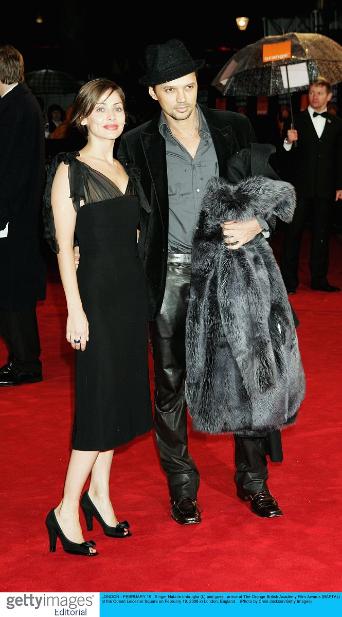 london - february 19:  singer natalie imbruglia (l) and guest  a
