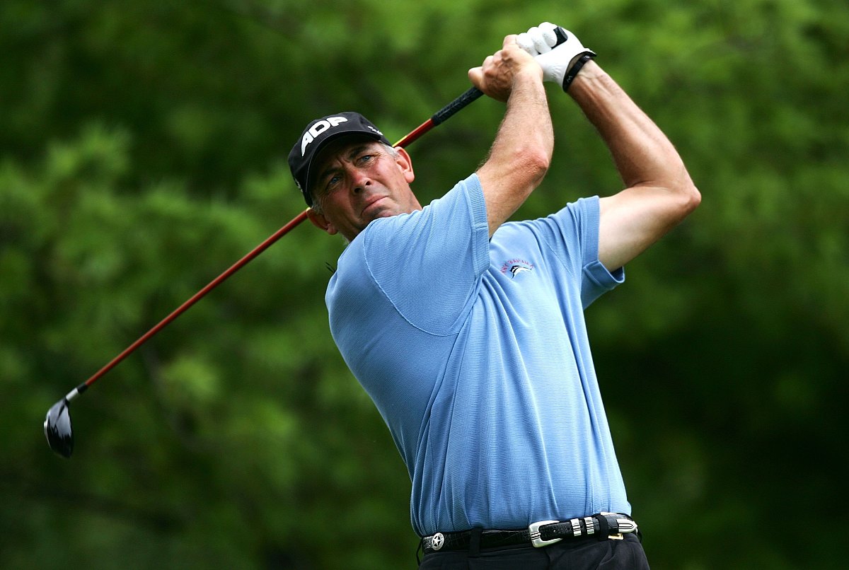 medinah, il - august 17:  tom lehman plays a tee shot on the ten