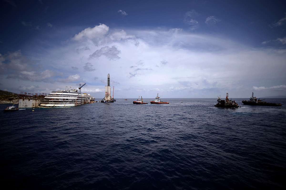 the wrecked costa concordia cruise ship lays off  giglio island 