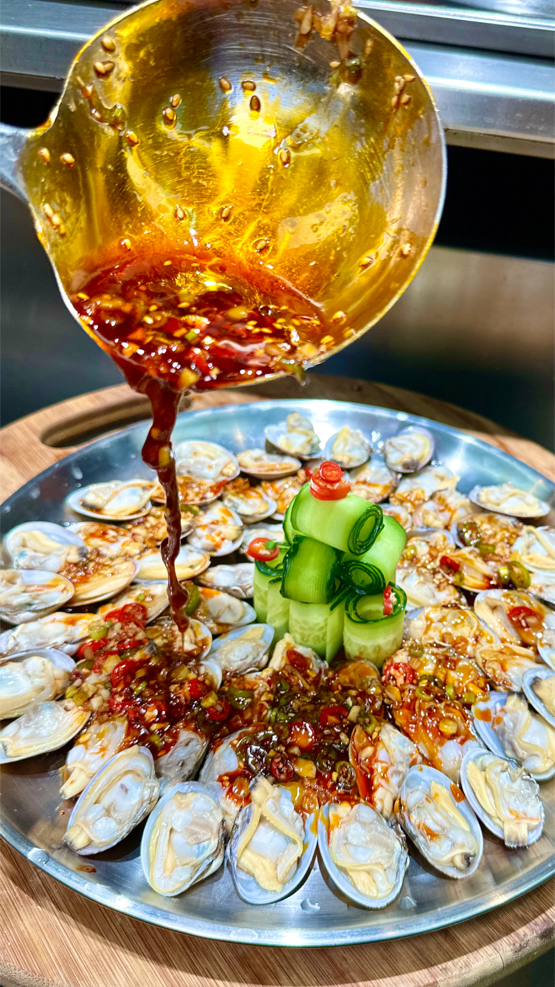 烧烤店的特色融合菜辣捞花蚬子