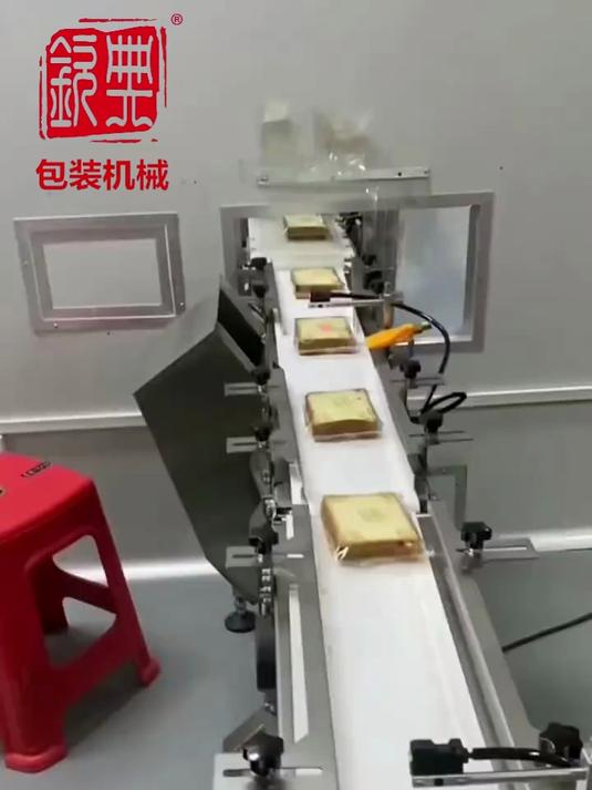 全自动面包理料套袋机