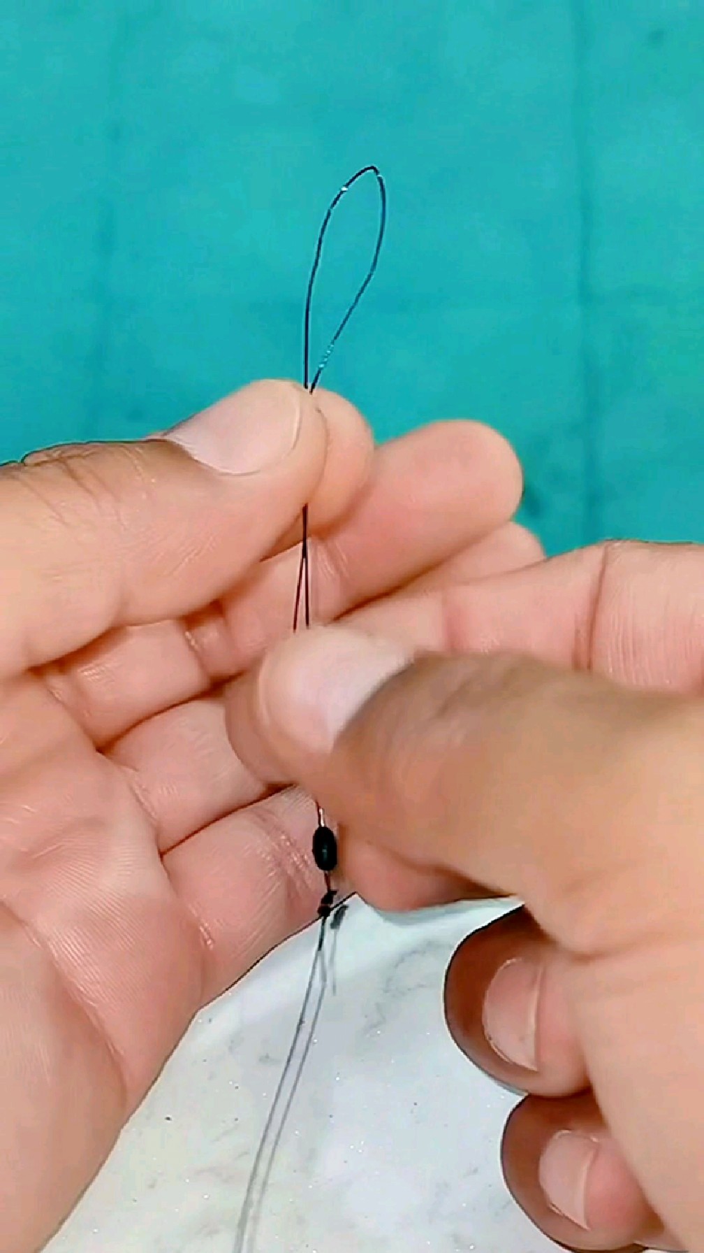 主线顶端打结,按照视频里的绑法就很给力哦!