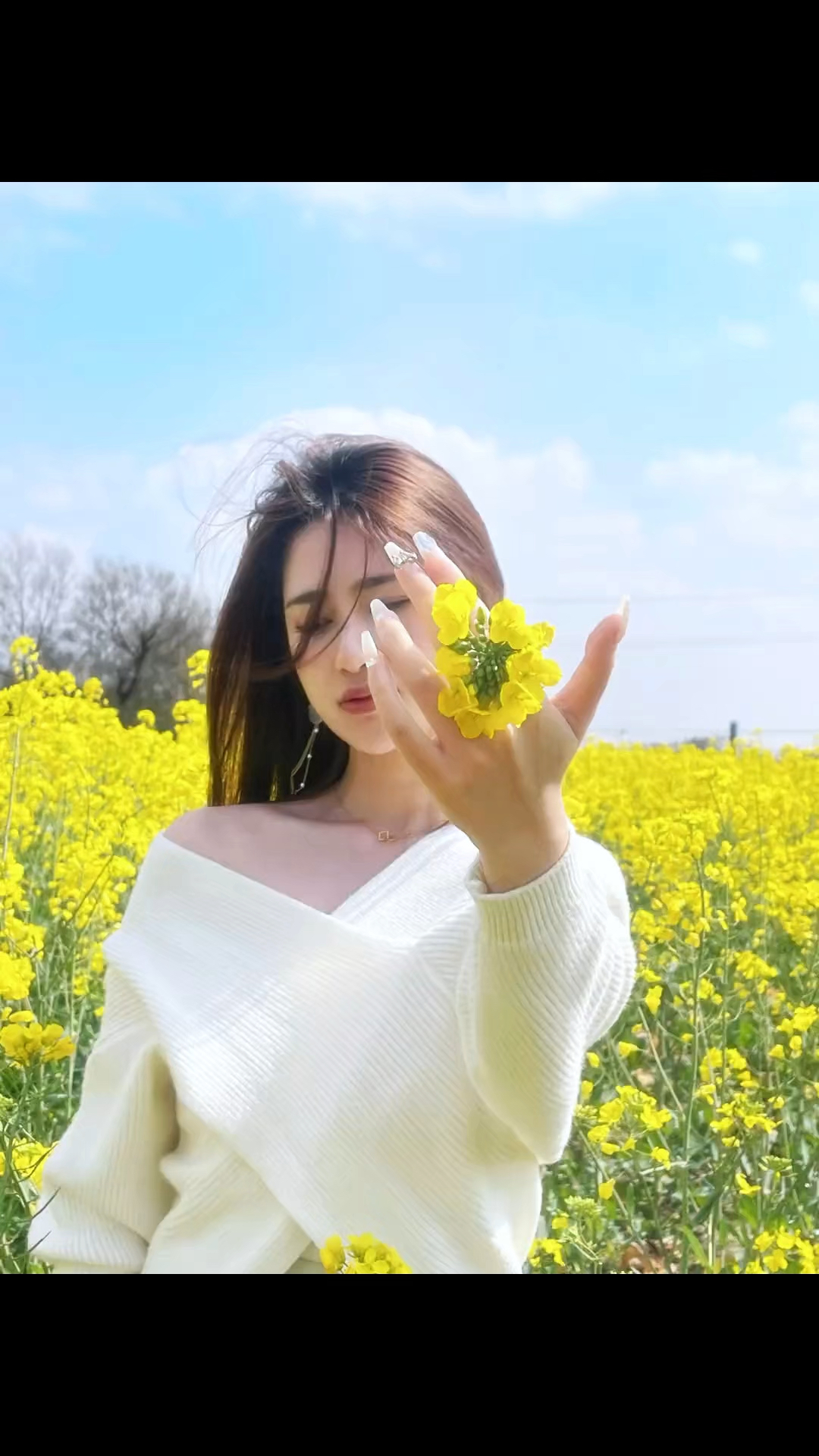 看到油菜花记得这样拍照