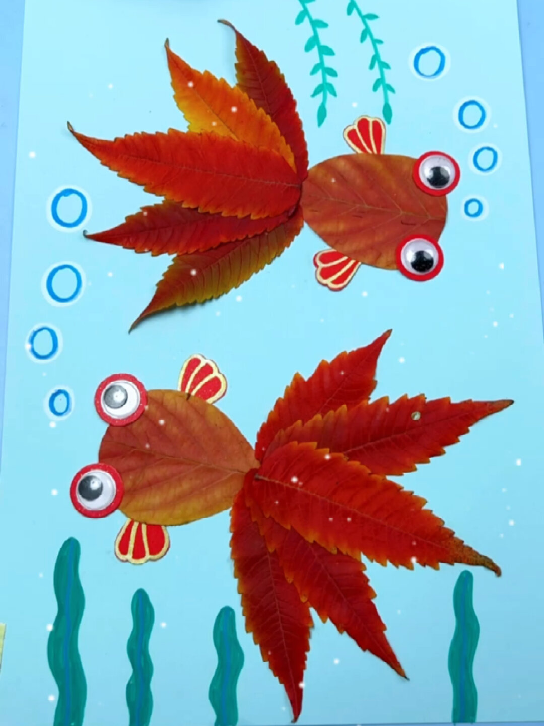 金鱼树叶贴画