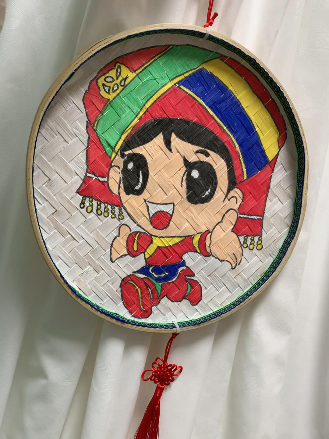 三月三民族手工绘簸箕画