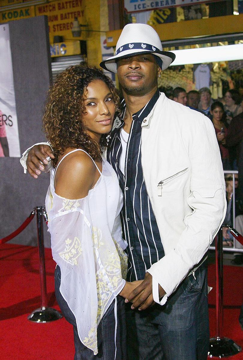 hollywood, ca - march 12:  actor damon wayans (r)  and a unident