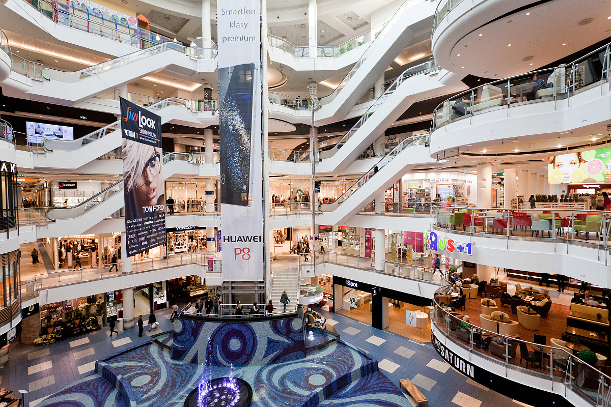 customers browse retail floors at the blue city shopping mall in