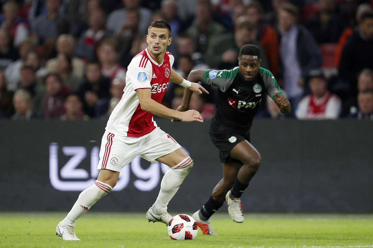 (l-r) dusan tadic of ajax, deyovaisio zeefuik of fc groningen du