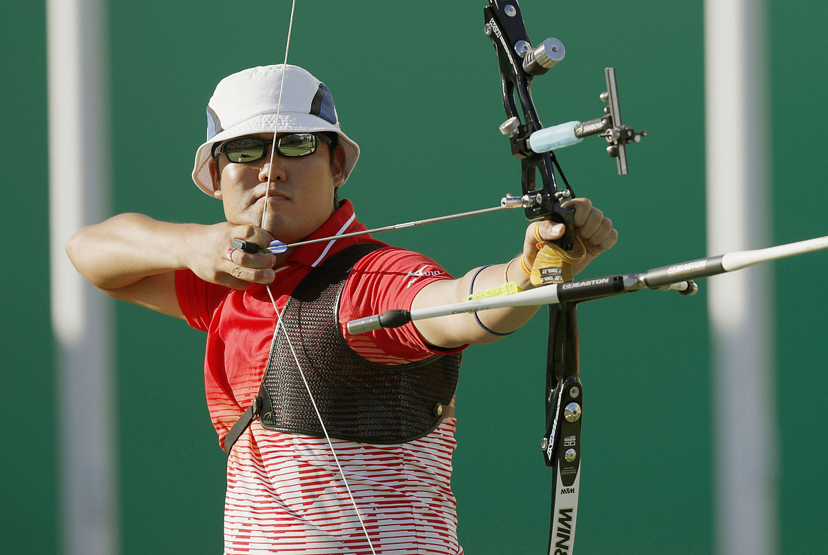 takaharu furukawa of japan releases an arrow in a men's archery 