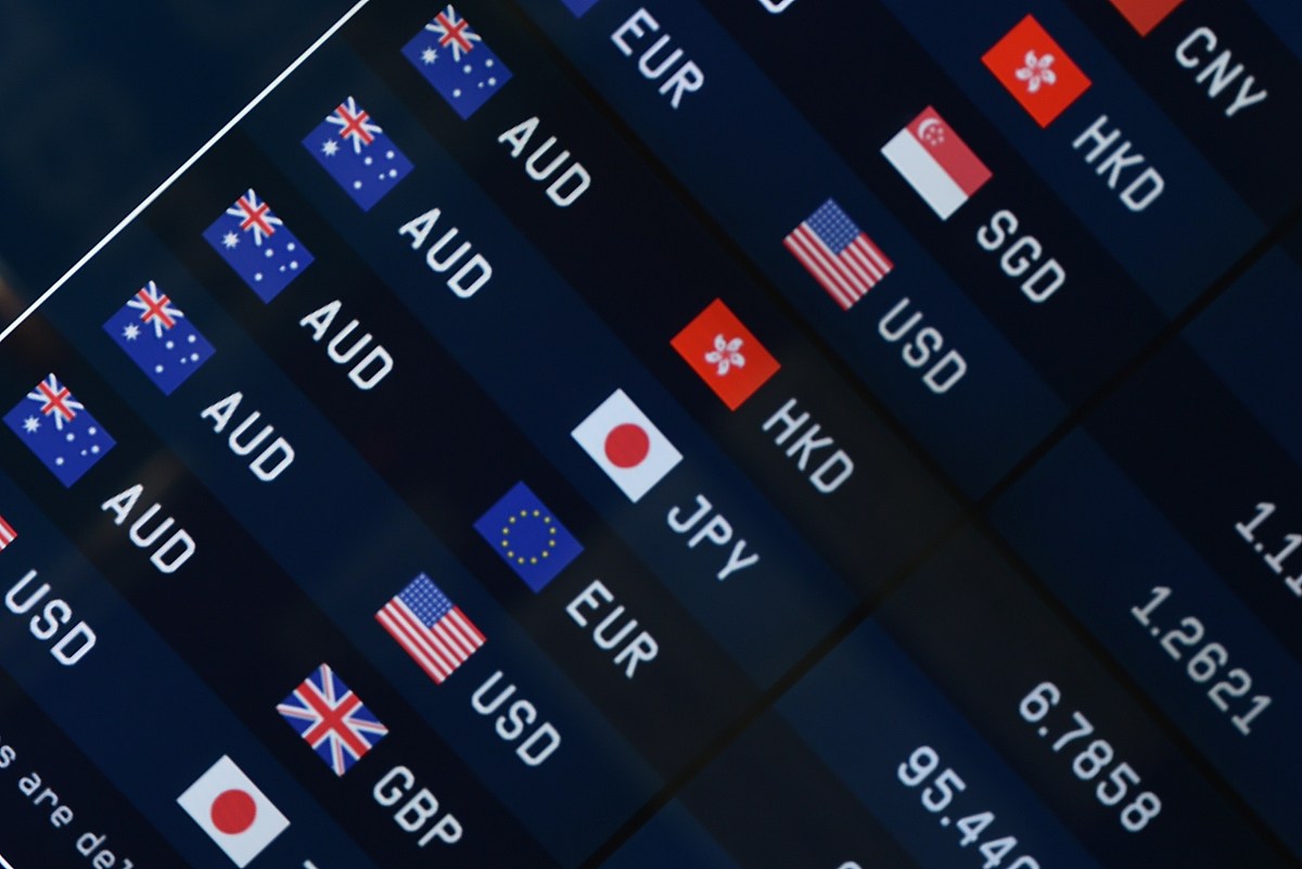 currency prices are seen on display at a bank on a street in syd