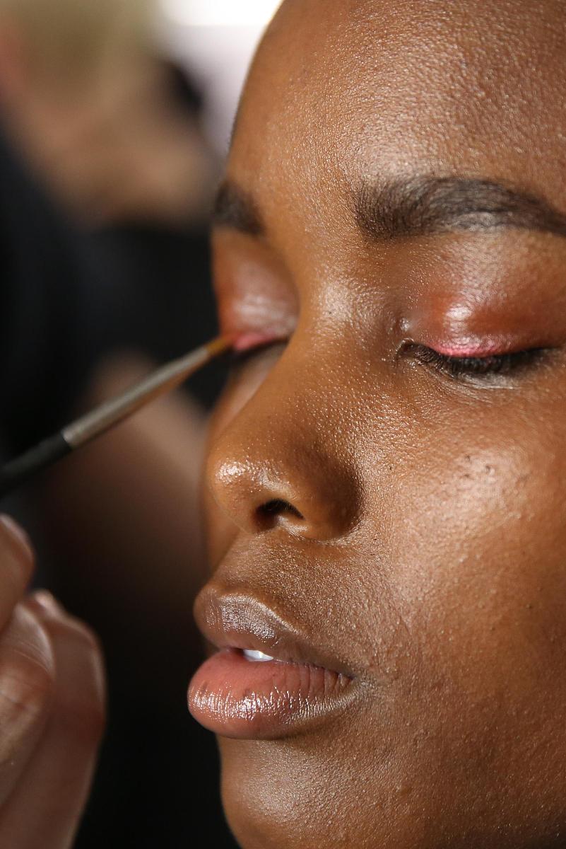 后台 , new york, ny - february 08:  a model prepares backstage a