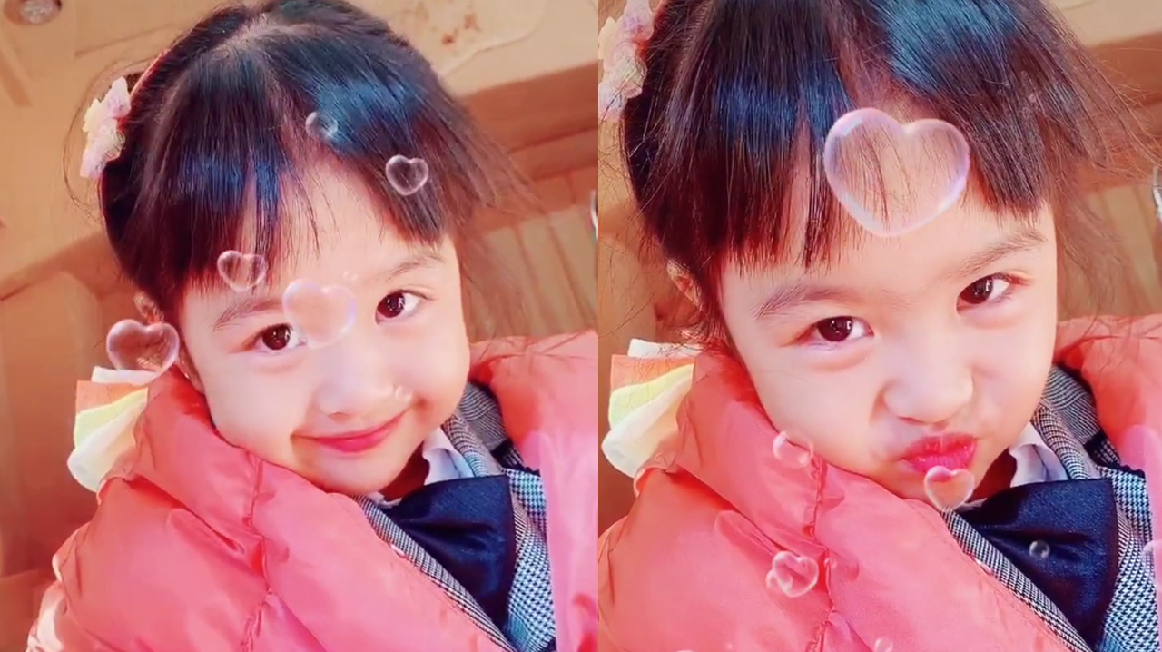 包贝尔晒女儿最新动态,包饺子表情呆萌,眼睛超大笑容迷人