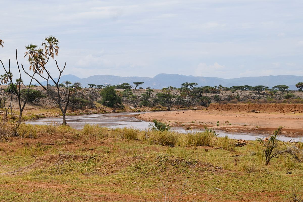 river against an arid landscape, kenya