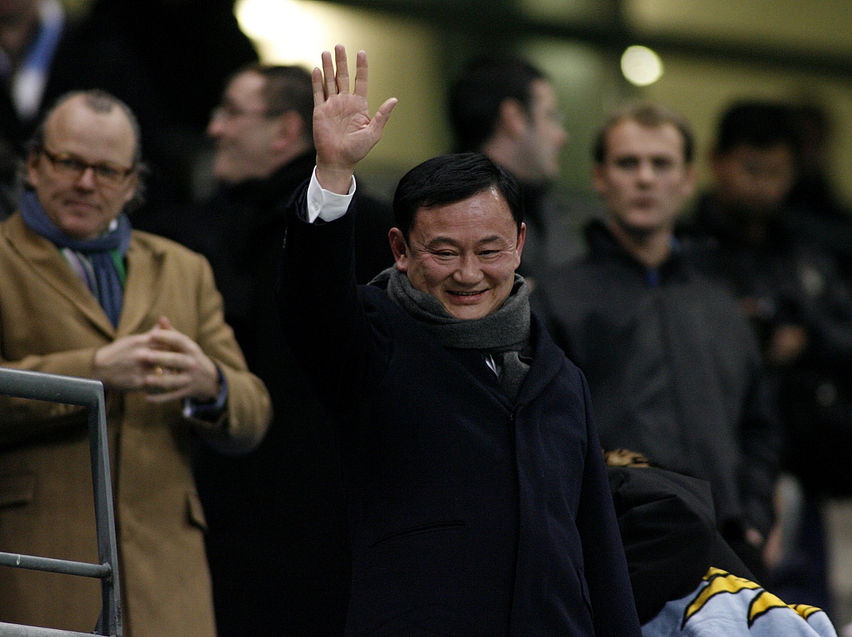 former   thai   prime   minister   and   owner   of   manchester