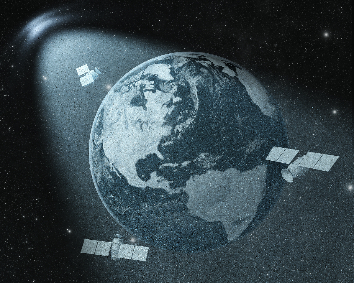 earth and orbiting satellites drawing  in spot of light