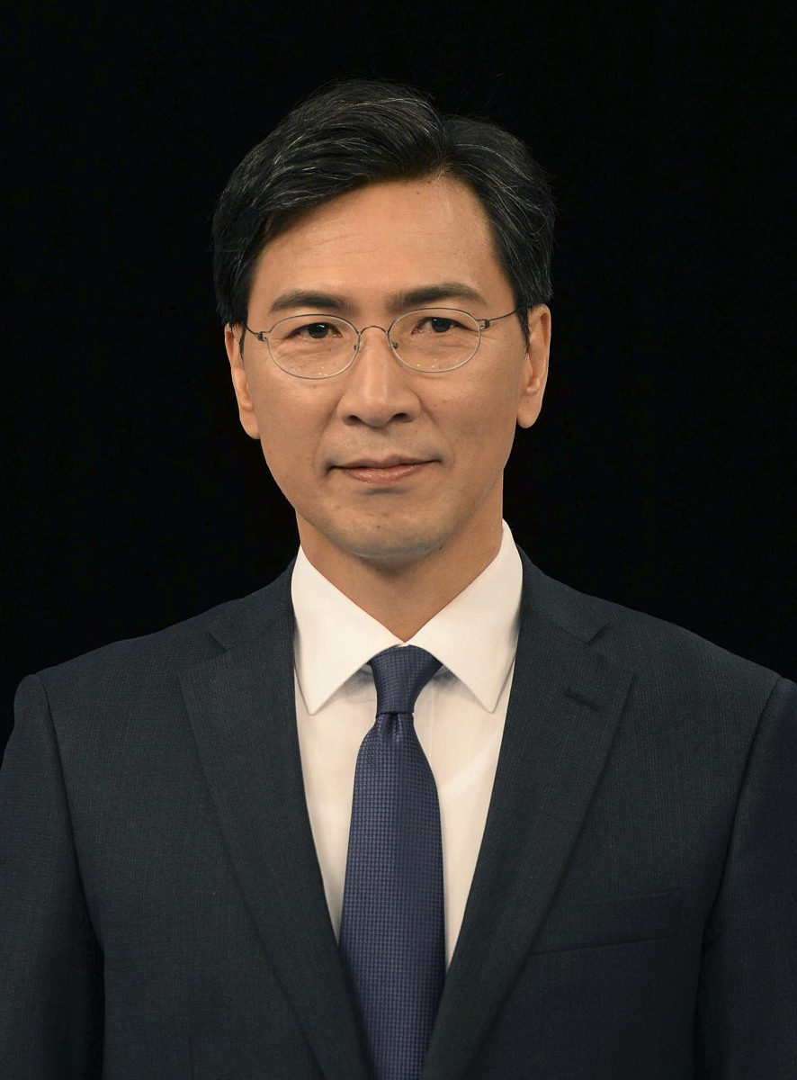 当地时间2017年3月14日,韩国首尔,安熙正.民主党总统候选人崔星,李在