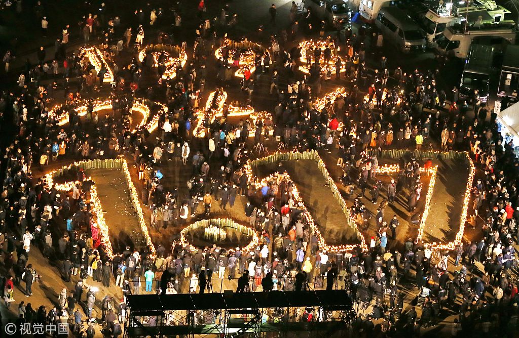 日本紀念阪神大地震24週年 民眾點燭守夜