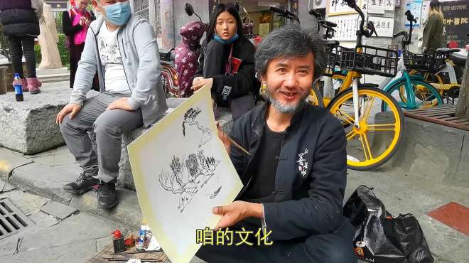 [图]西安画家街头画扇子成网红，每天只画5把，每天赚250元