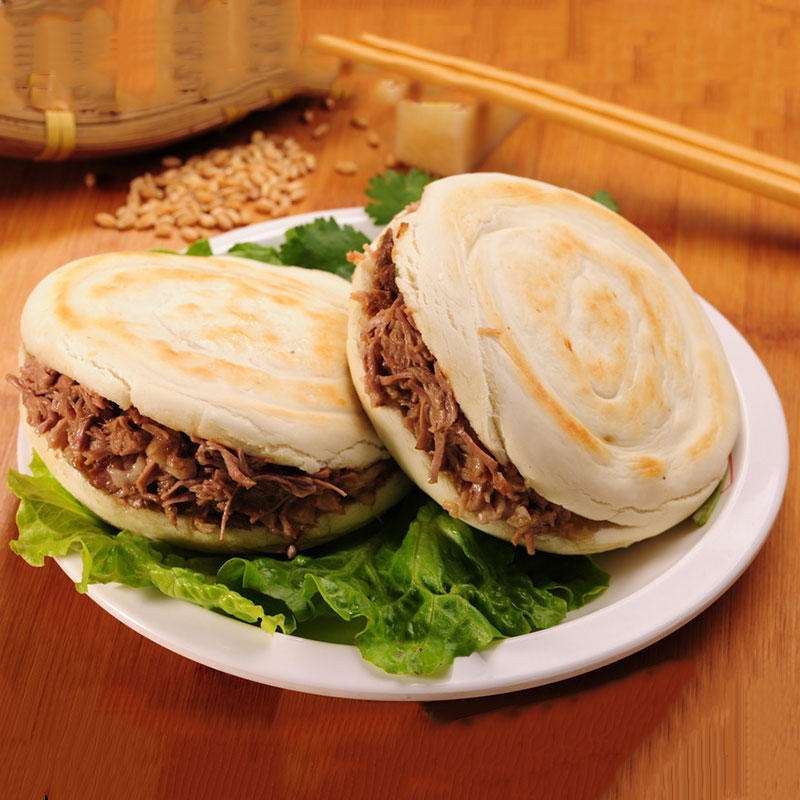 潼关的腊汁肉夹馍是怎么做的?单喜欢吃可不行,得知道怎么做的!