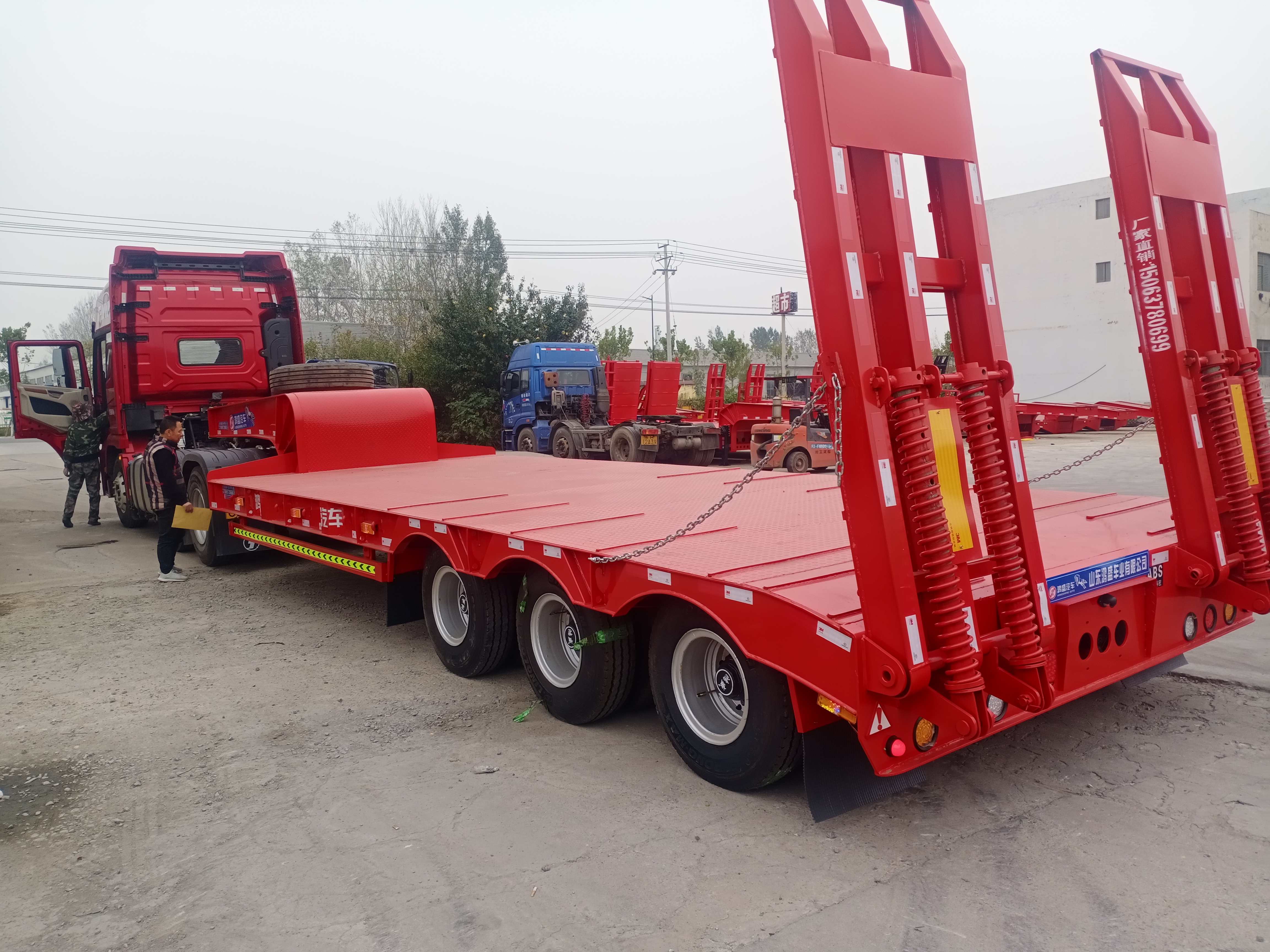 爬梯机械平板半挂车又名翘板拖挂车