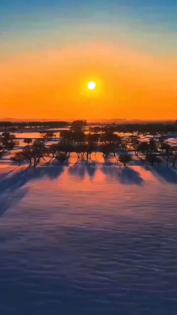 描写落日雪景图片